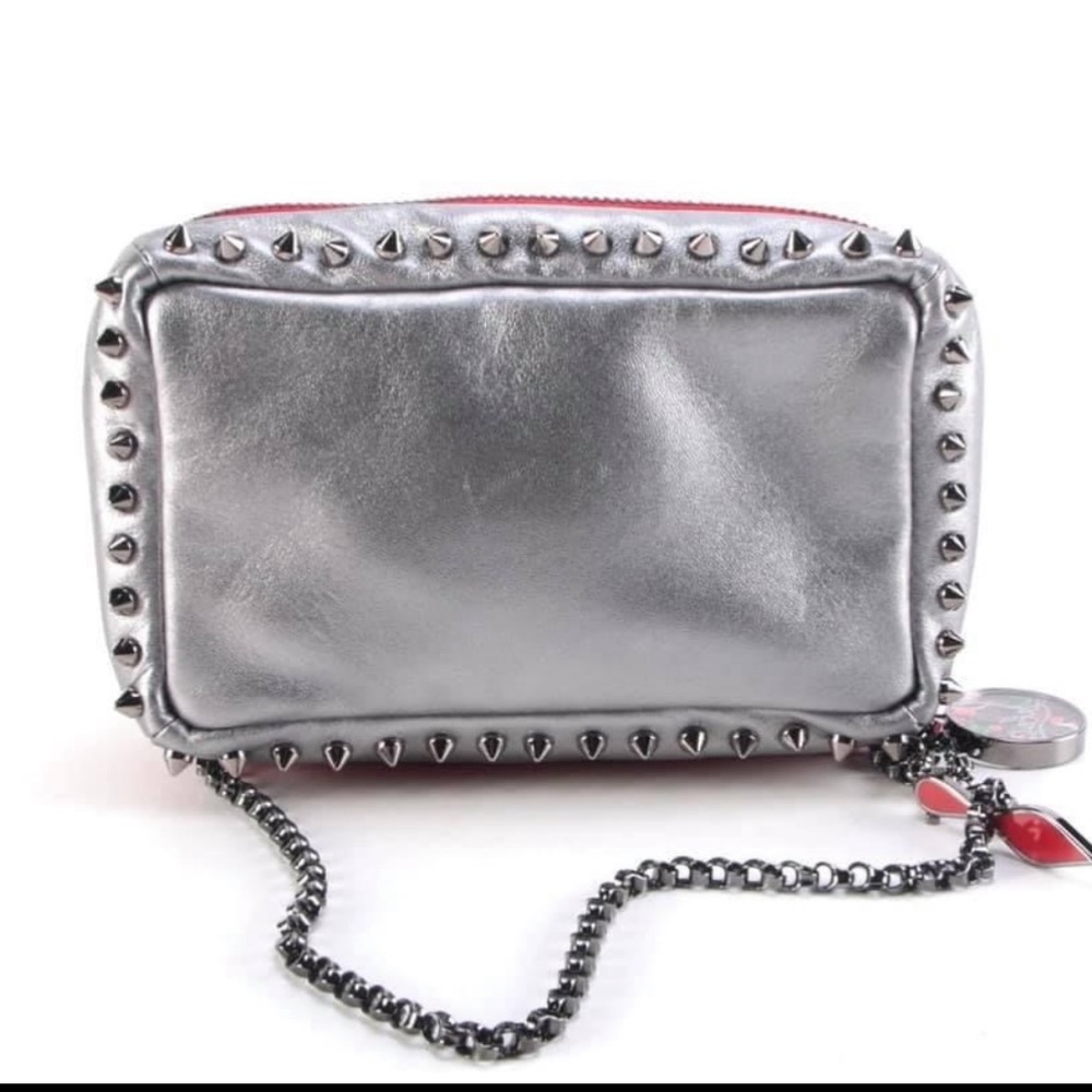 Christian Louboutin silver studded poloutin clutch.